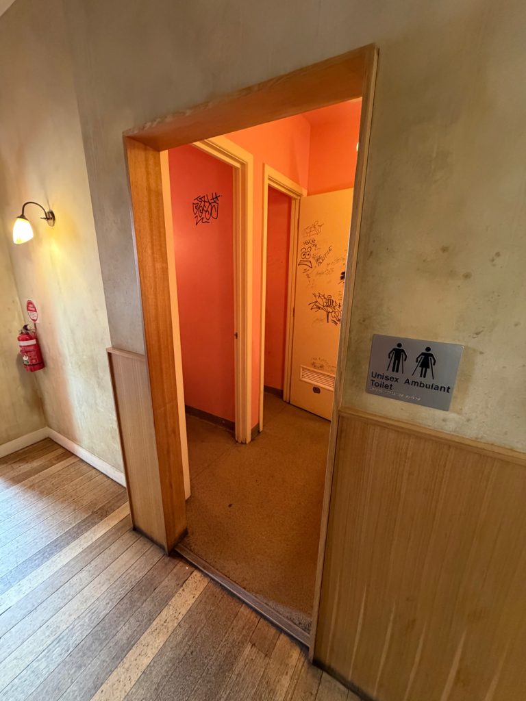Entrance to the unisex ambulant toilets. Main toilets entrance width: 870 mm.